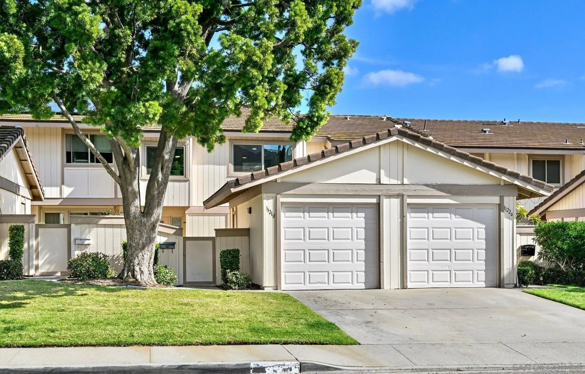 11218 Poblado Road San Diego, CA 92127 - Photo 3 of 35 a front view of a house with a garden