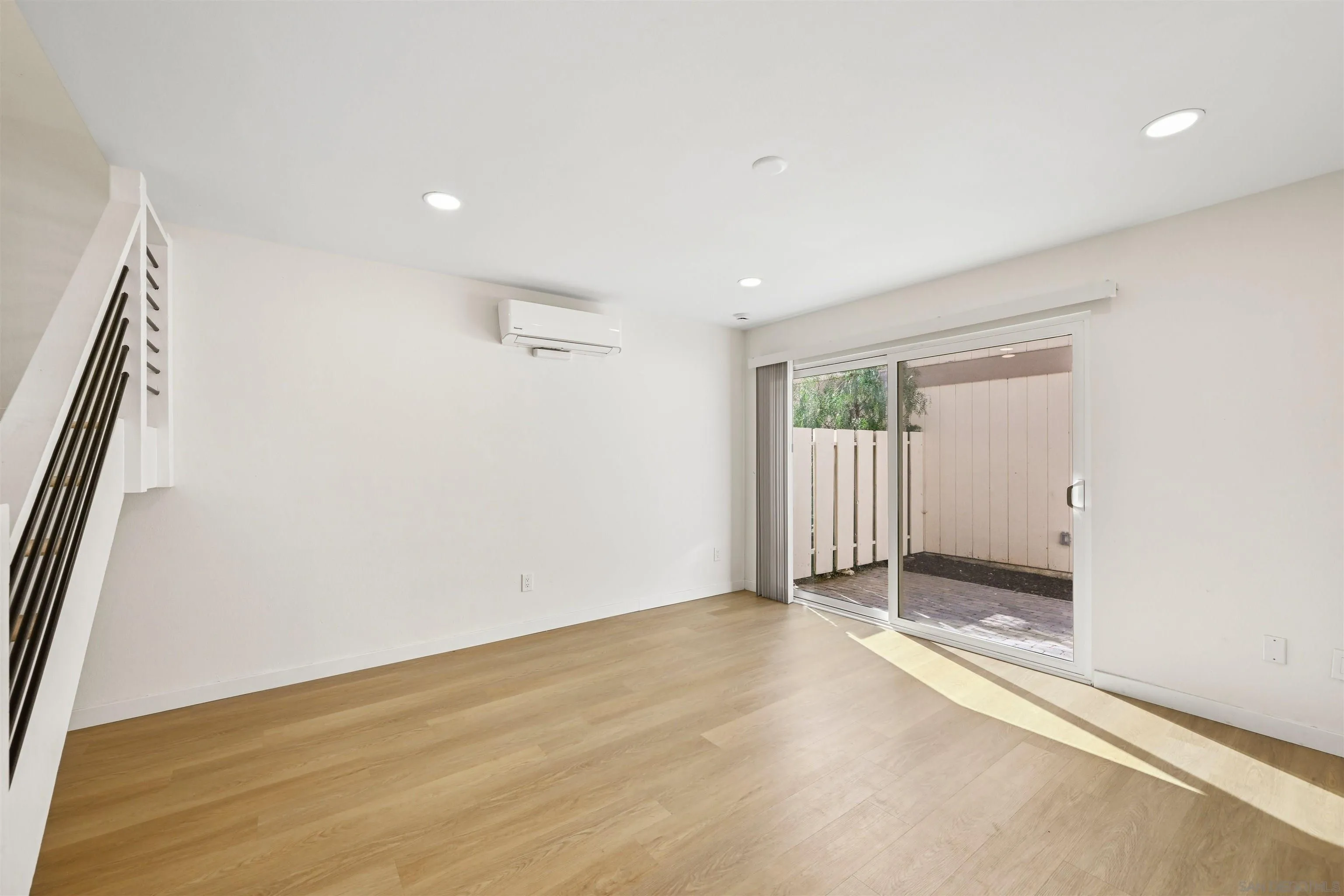 11218 Poblado Road San Diego, CA 92127 - Photo 8 of 35 wooden floor in an empty room with a window
