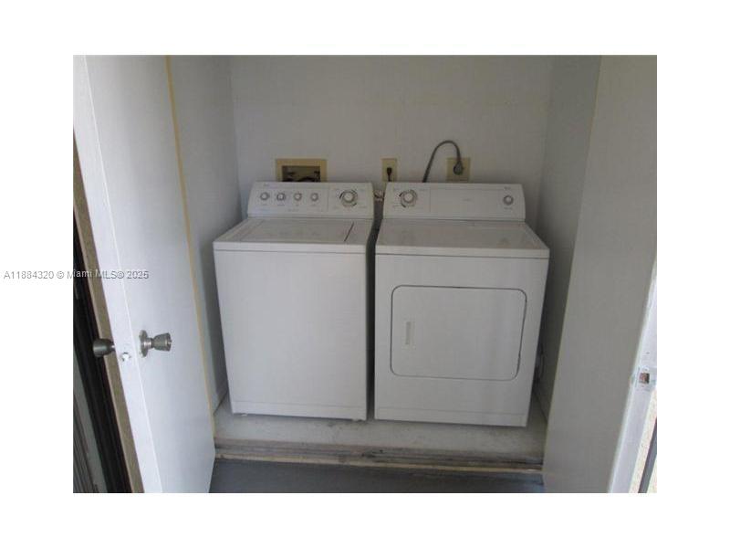15040 Southwest 103rd Lane, Unit 3202 Miami, FL 33196 - Photo 13 of 14 a utility room with dryer and washer