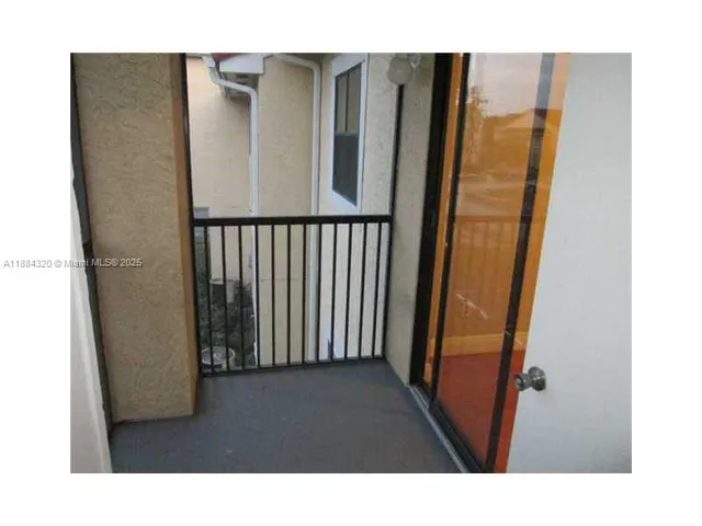 a picture of a door and an empty room