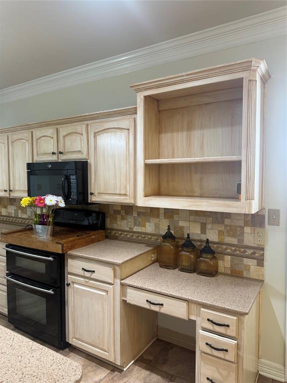 201 Woodhaven Drive Minden, LA 71055 - Photo 11 of 31 Kitchen featuring custom light wood-finish cabinetry, a built-in double oven, and integrated desk area