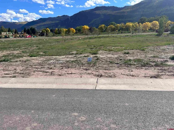 a view of a golf course with a yard