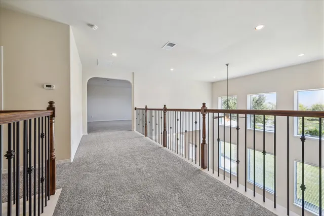 a view of a hallway with windows