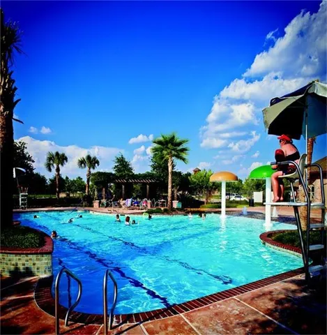 a view of a backyard with sitting area