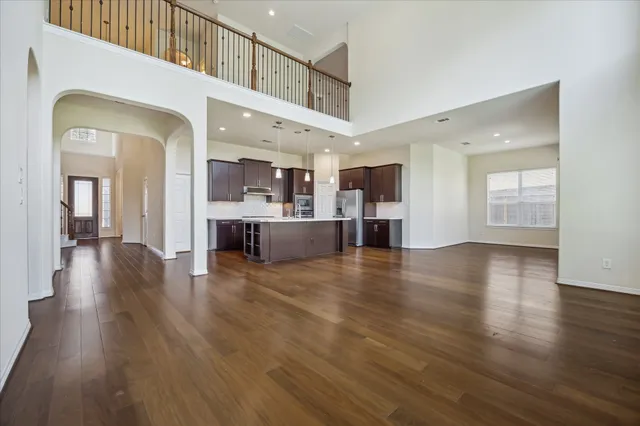a view of a living room and kitchen with a large window