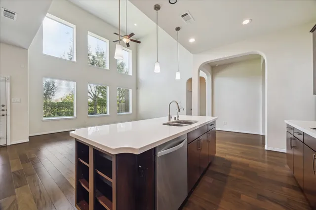 a kitchen with a stove a sink and a refrigerator