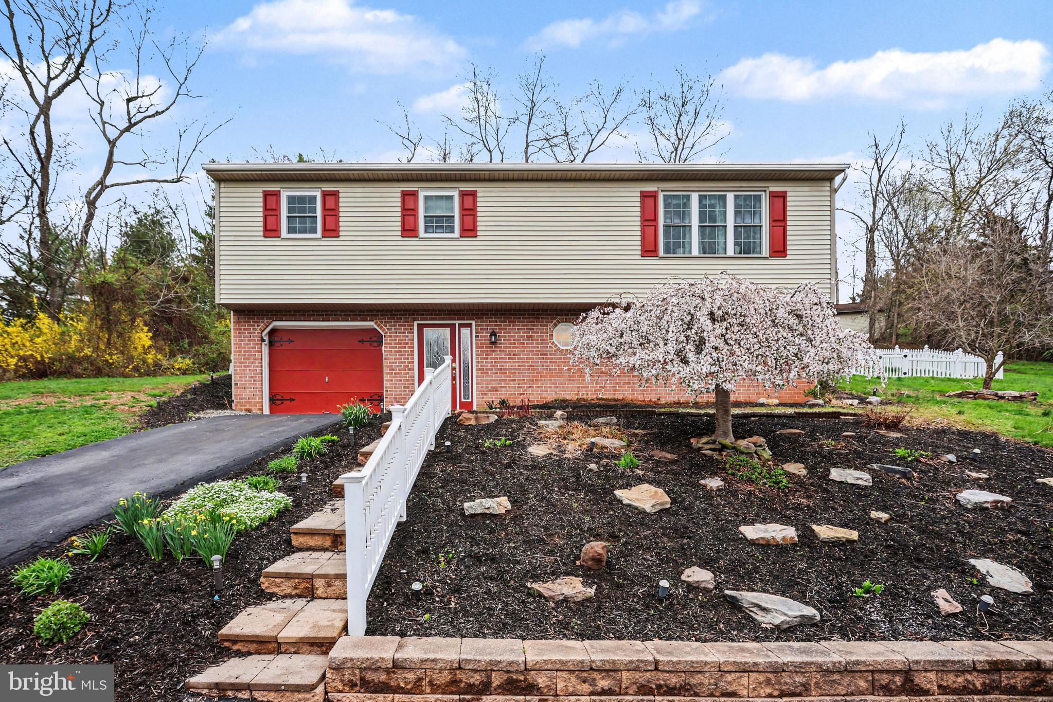 90 Eagle Lane Etters, PA 17319 - Photo 1 of 33 a front view of a house with garden