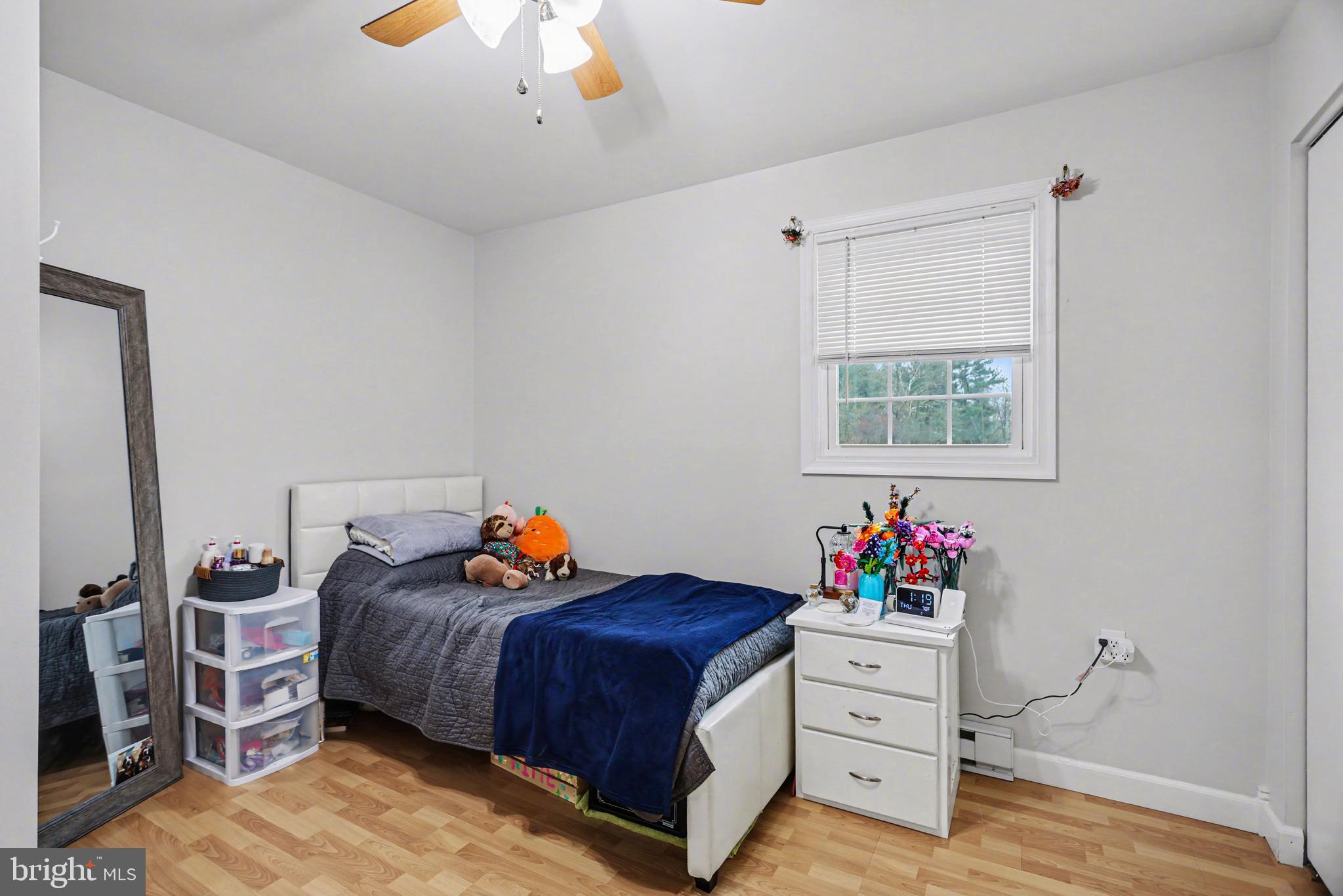 90 Eagle Lane Etters, PA 17319 - Photo 16 of 33 a bedroom with a bed and a chandelier