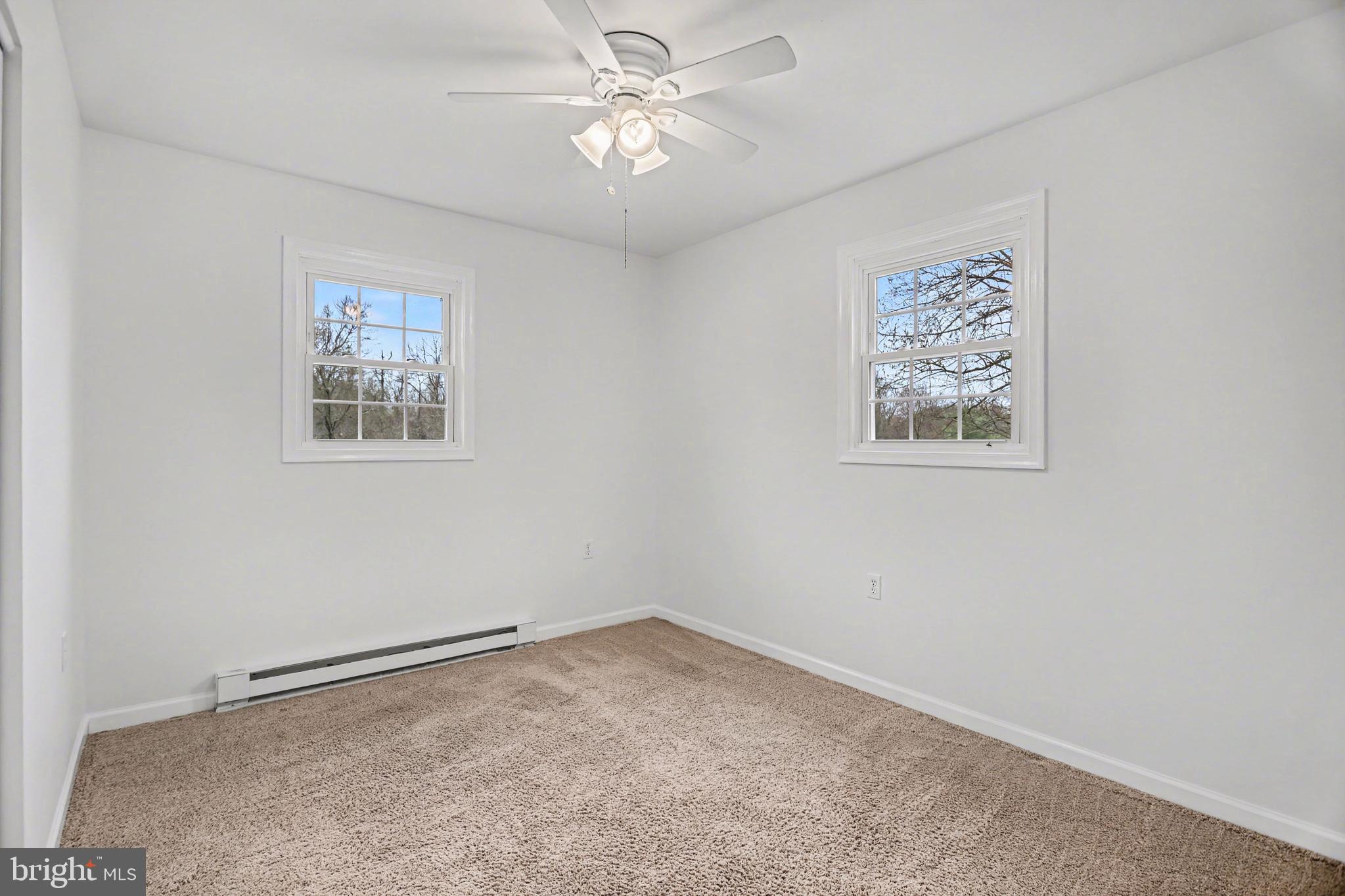 90 Eagle Lane Etters, PA 17319 - Photo 18 of 33 an empty room with a window and a fan