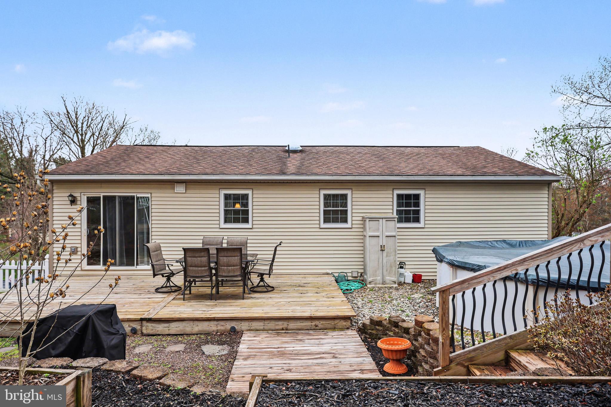 90 Eagle Lane Etters, PA 17319 - Photo 24 of 33 a view of a patio with couches table and chairs and potted plants
