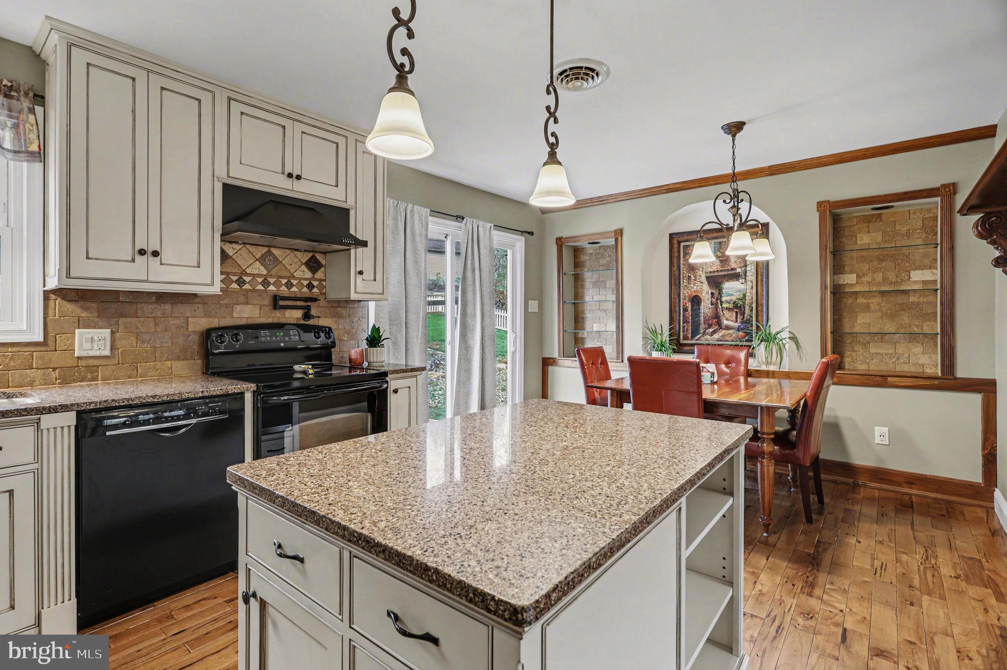 90 Eagle Lane Etters, PA 17319 - Photo 7 of 33 a kitchen with granite countertop a stove cabinets and refrigerator