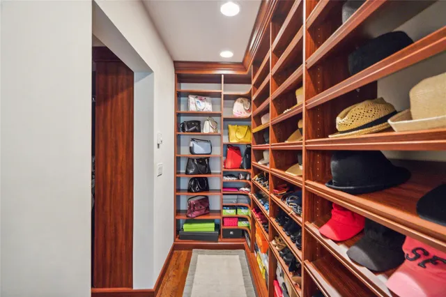 a spacious bathroom with a tub sink and mirror