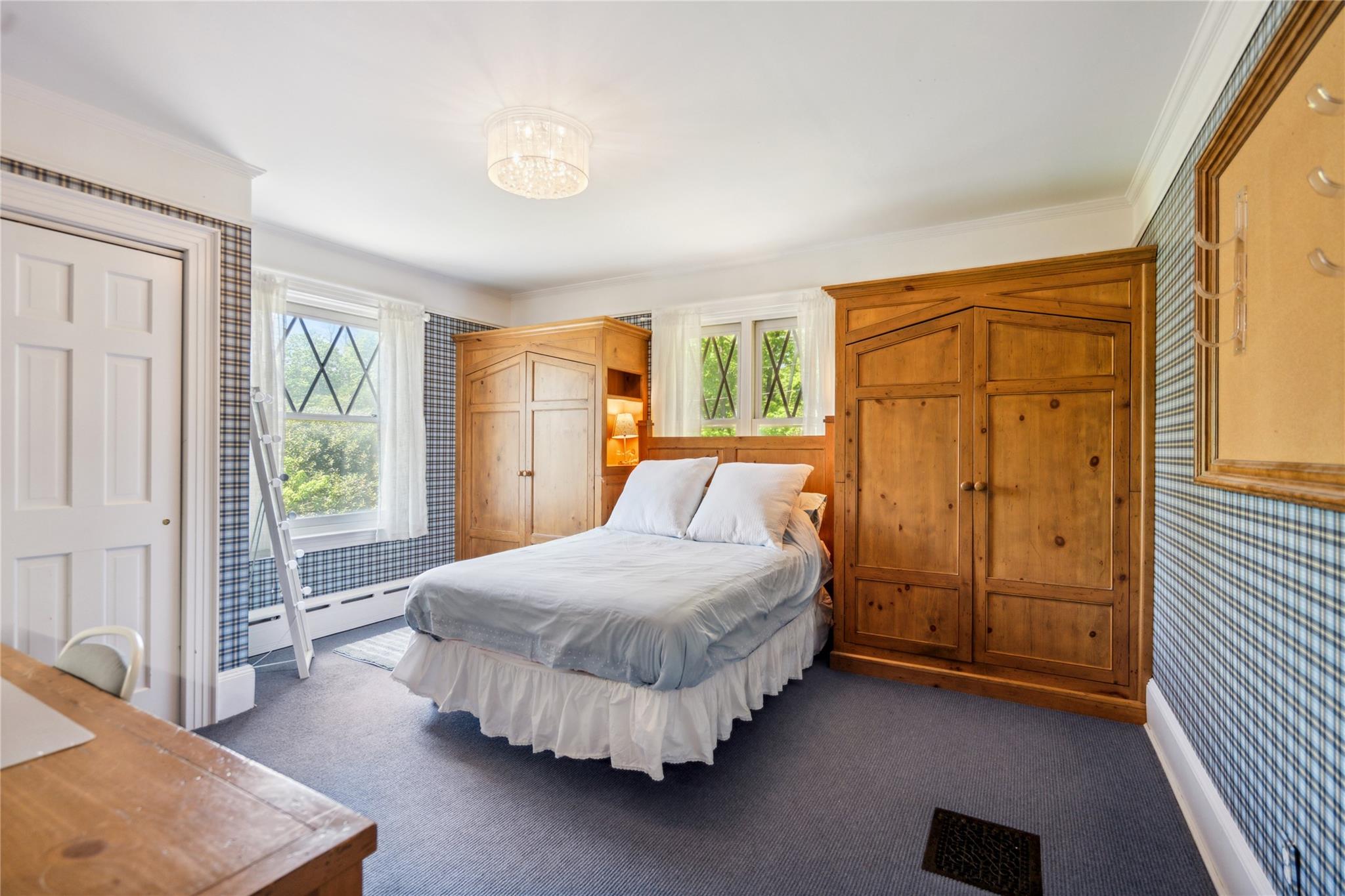 17 The Intervale Roslyn Estates, NY 11577 - Photo 23 of 33 a bedroom with a bed and a window
