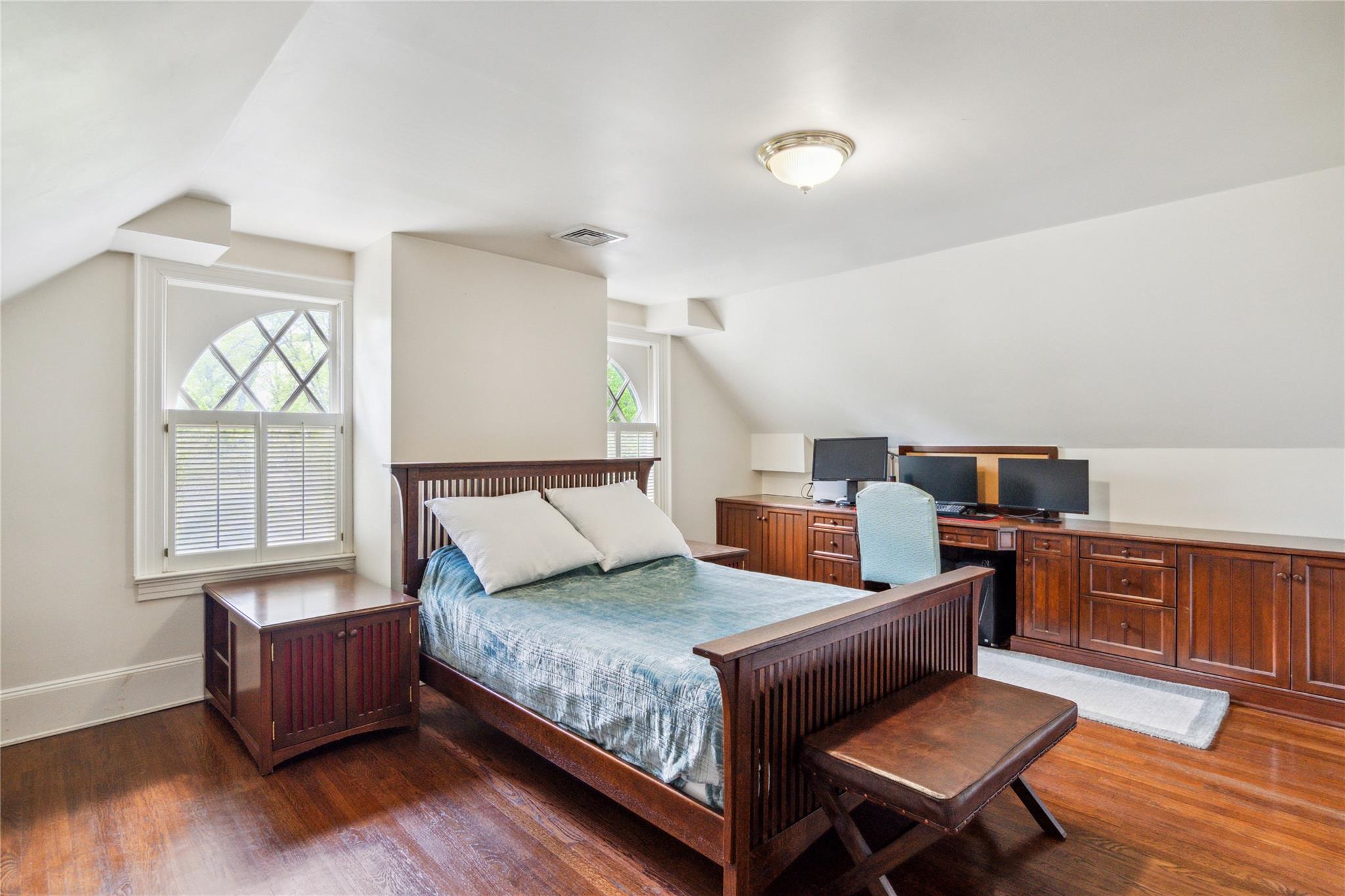 17 The Intervale Roslyn Estates, NY 11577 - Photo 25 of 33 a bedroom with a bed and wooden floor