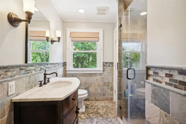 a living room with furniture toys and a chandelier