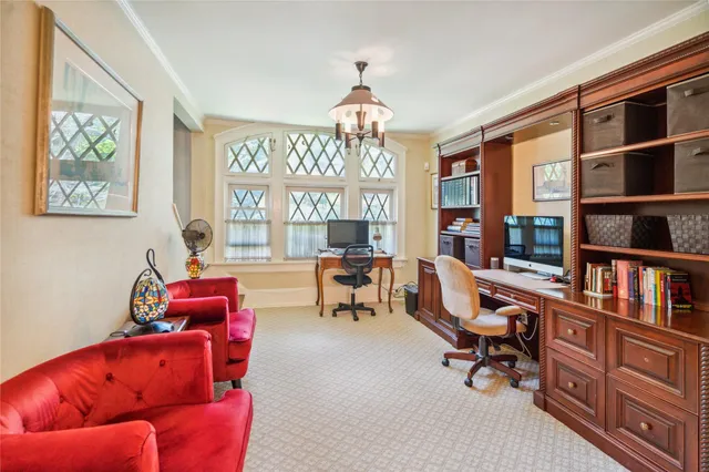 a view of a livingroom with furniture and a dining table