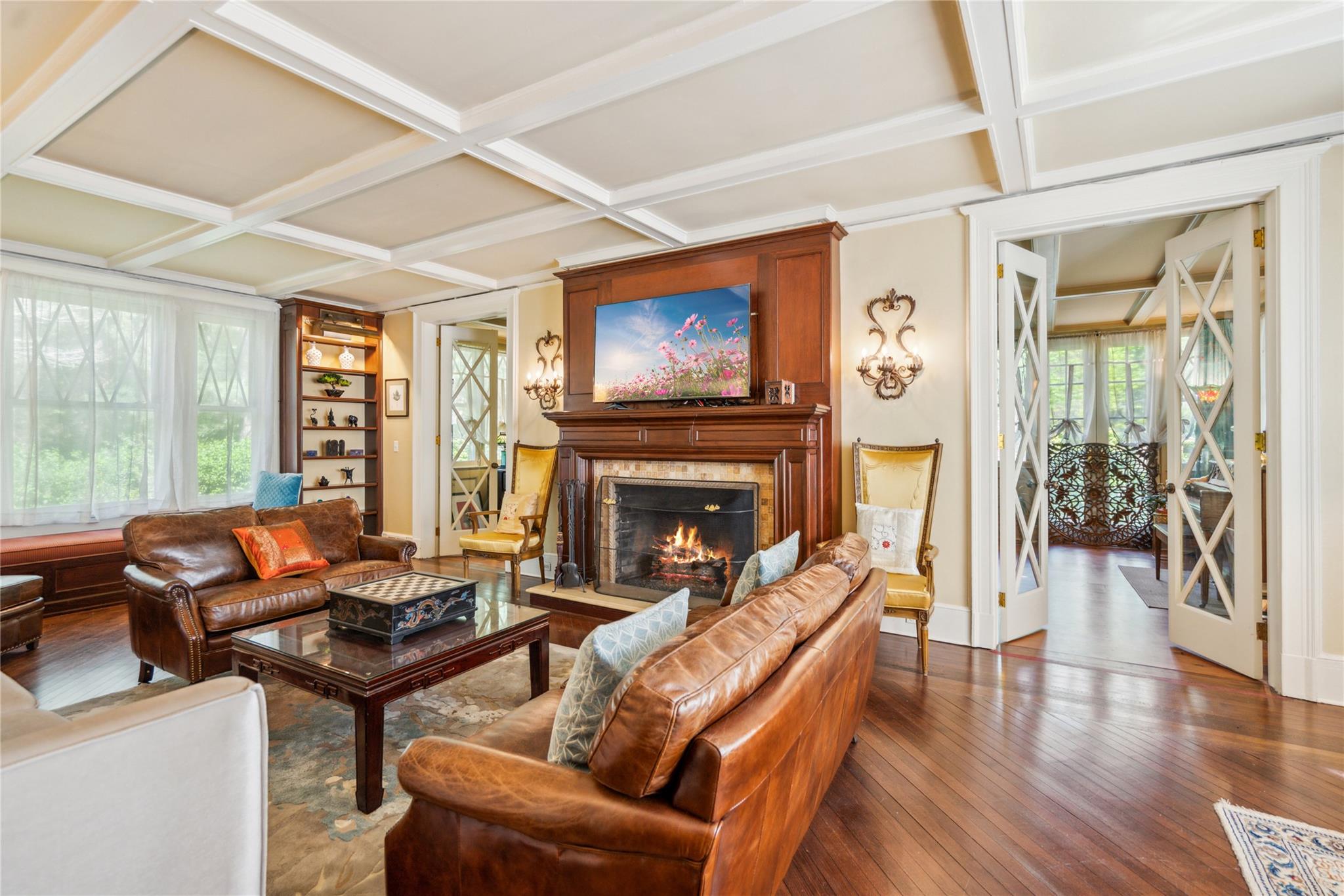 17 The Intervale Roslyn Estates, NY 11577 - Photo 9 of 33 a living room with furniture a fireplace and a large window