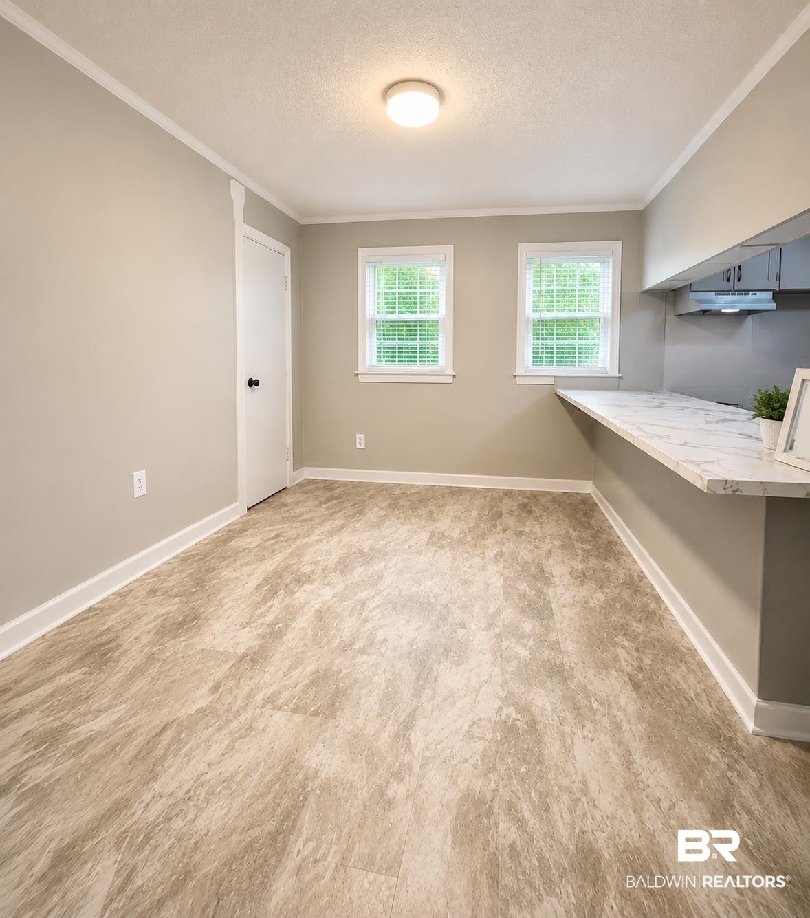 226 Elizabeth Street Evergreen, AL 36401 - Photo 13 of 35 Spacious room featuring wood-finish flooring and a neutral color palette