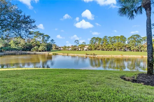 a view of a lake with a big yard