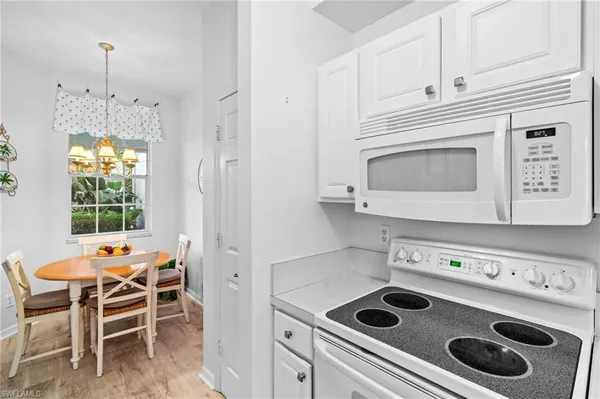 a kitchen with a stove and a microwave