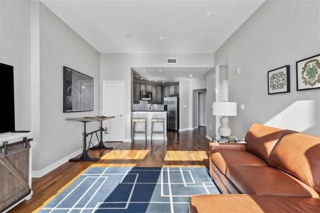 a living room with furniture and a rug
