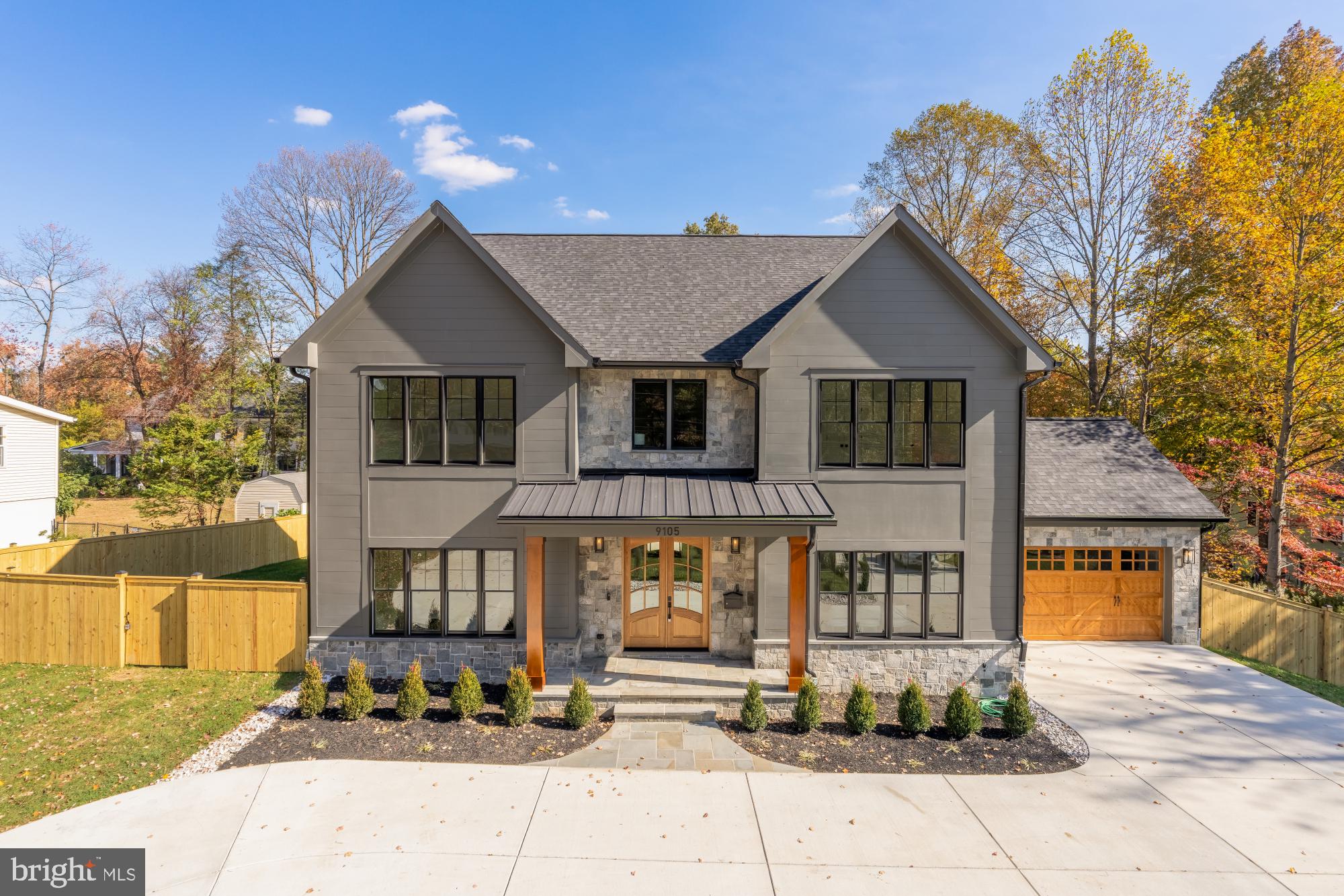 9105 Seven Locks Road Bethesda, MD 20817 - Photo 1 of 84 a front view of a house with garden