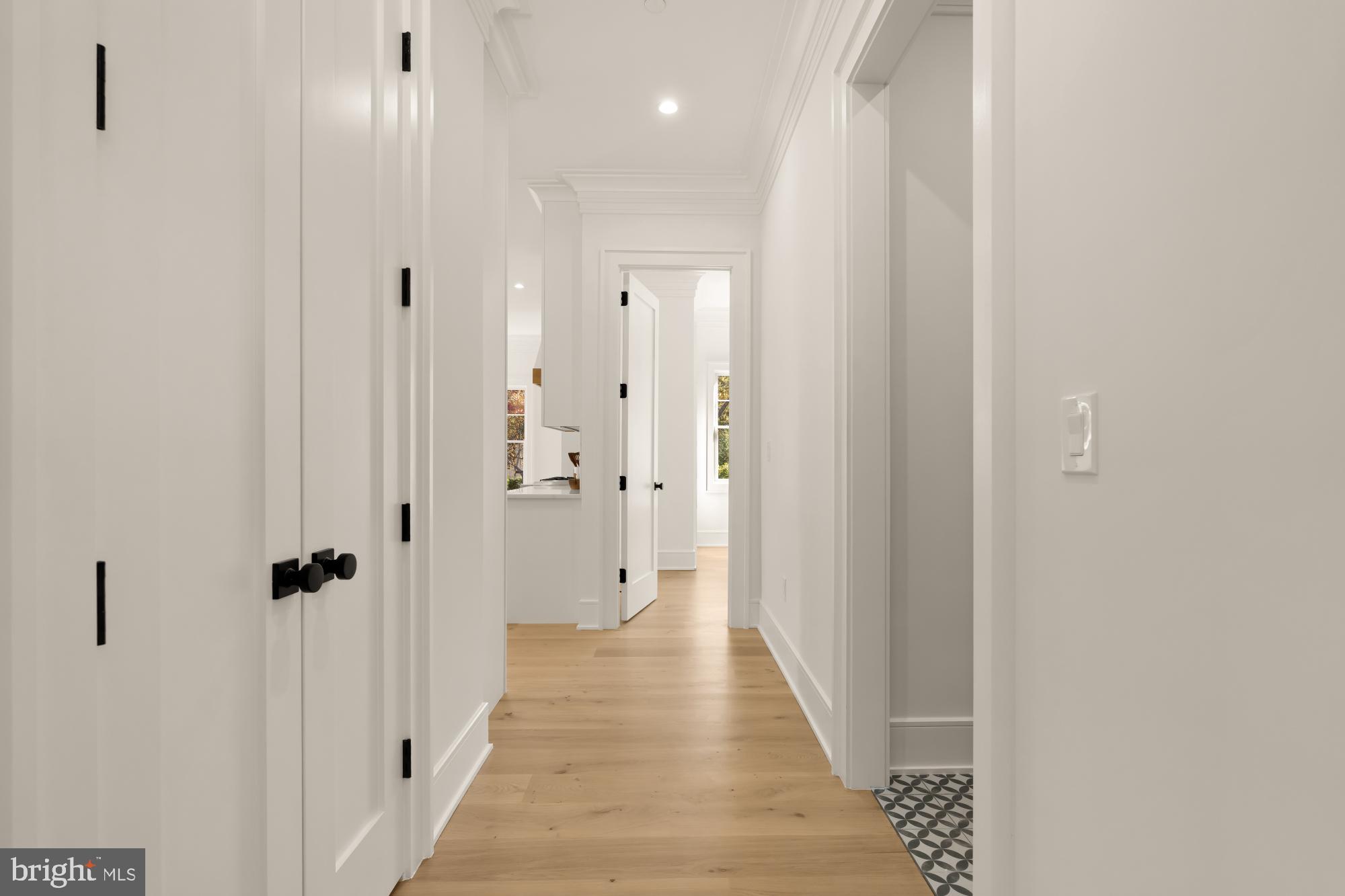 9105 Seven Locks Road Bethesda, MD 20817 - Photo 24 of 84 a view of a hallway with wooden floor and closet area