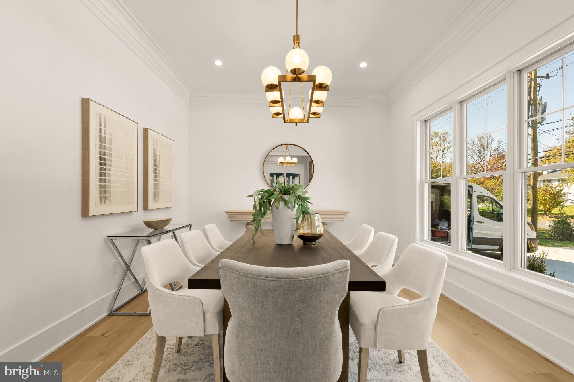 9105 Seven Locks Road Bethesda, MD 20817 - Photo 28 of 84 a dining room with furniture wooden floor a potted plant and a chandelier