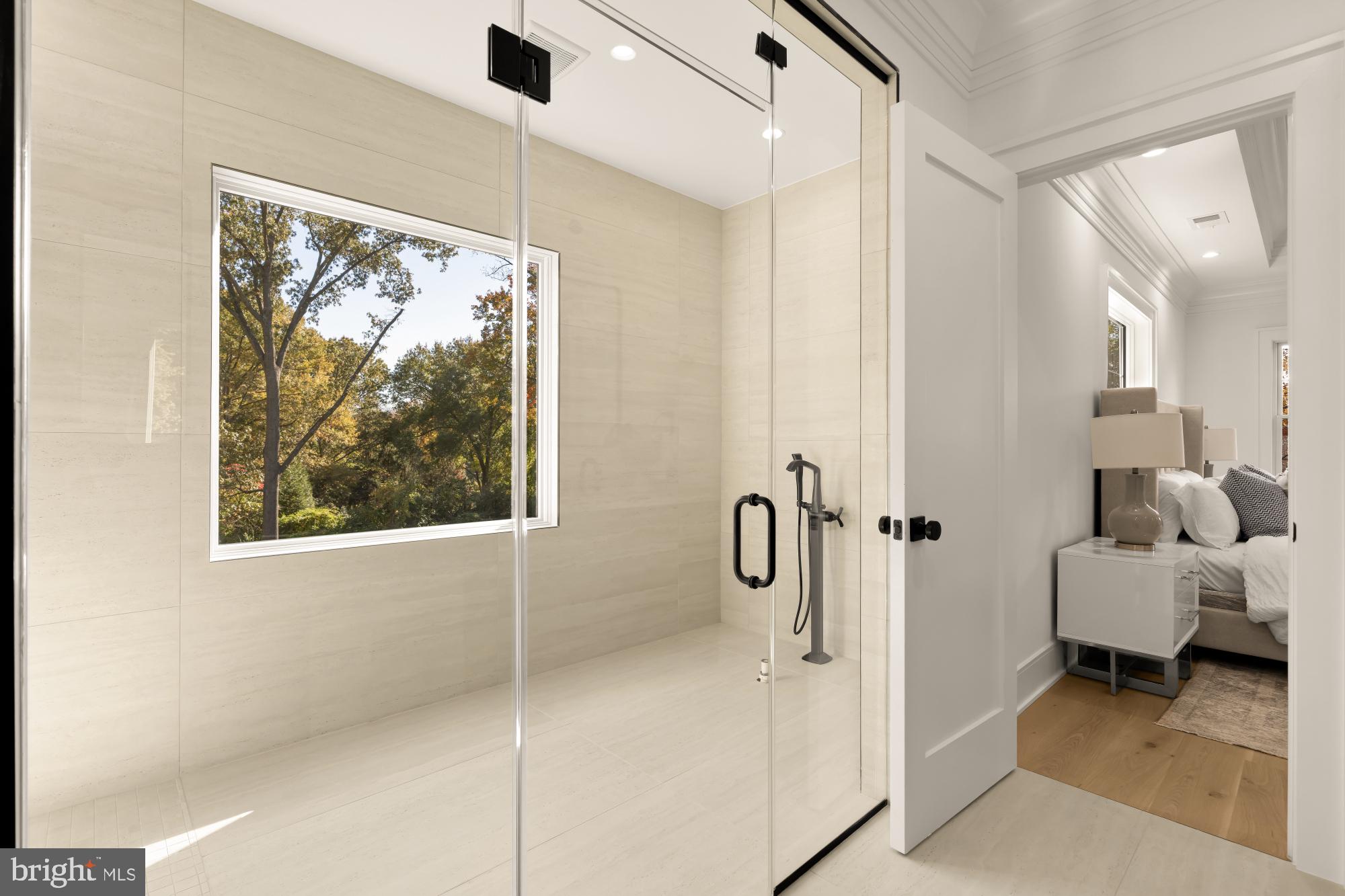 9105 Seven Locks Road Bethesda, MD 20817 - Photo 41 of 84 a bathroom with a tub and shower