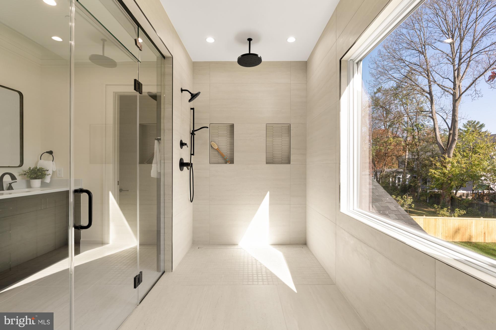 9105 Seven Locks Road Bethesda, MD 20817 - Photo 42 of 84 a bathroom with a bathtub and a shower