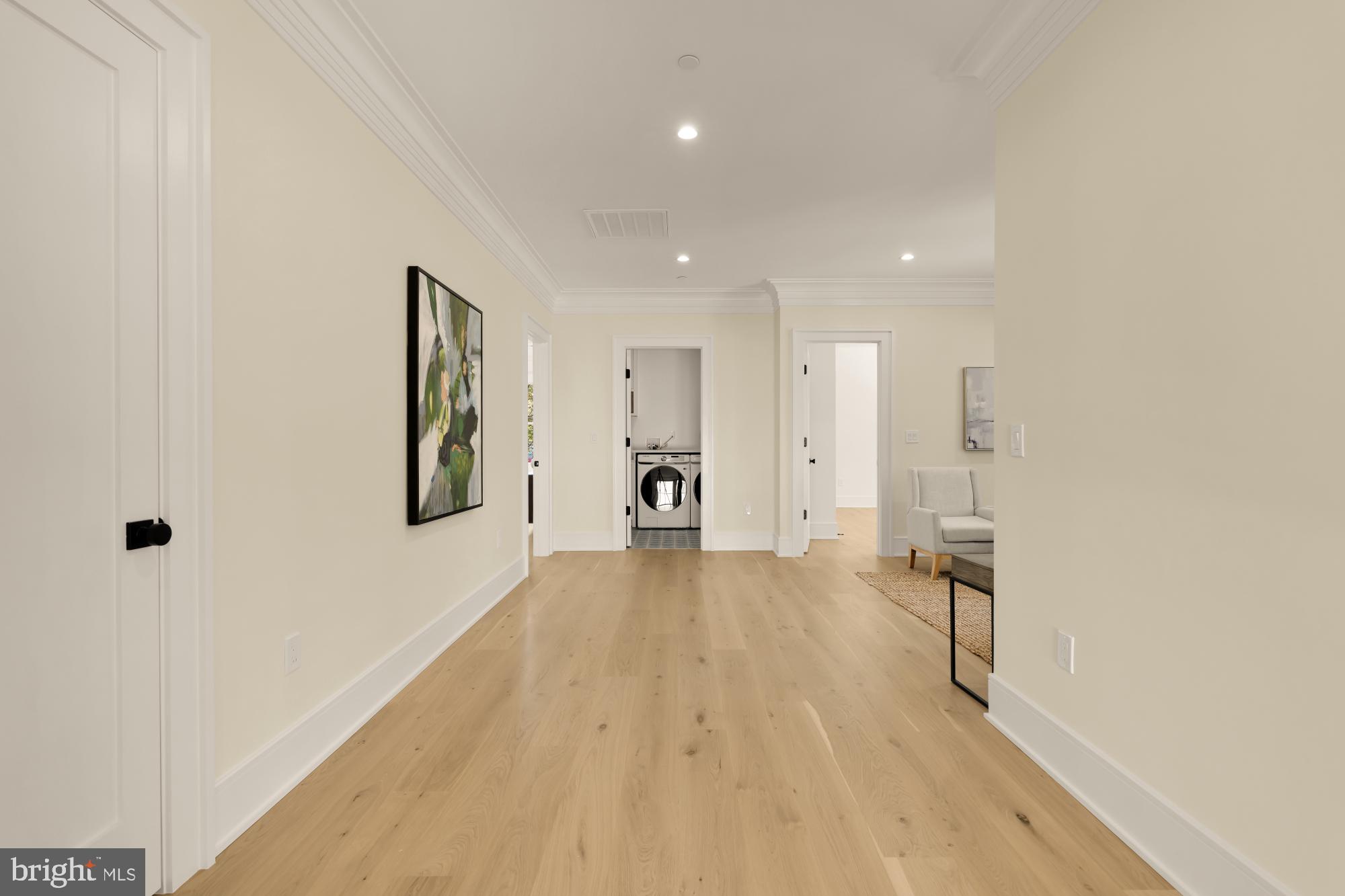 9105 Seven Locks Road Bethesda, MD 20817 - Photo 55 of 84 a view of a big room with wooden floor and a large window