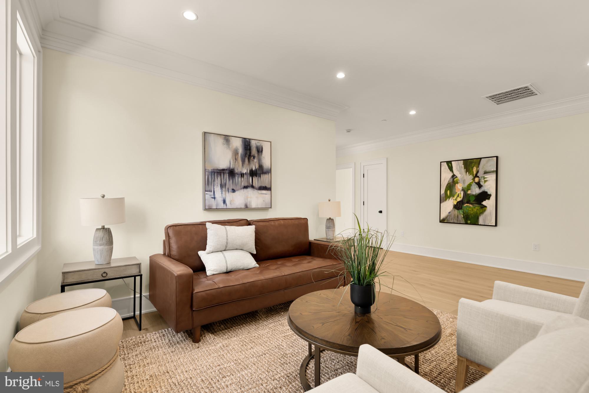 9105 Seven Locks Road Bethesda, MD 20817 - Photo 57 of 84 a living room with furniture and a wooden floor