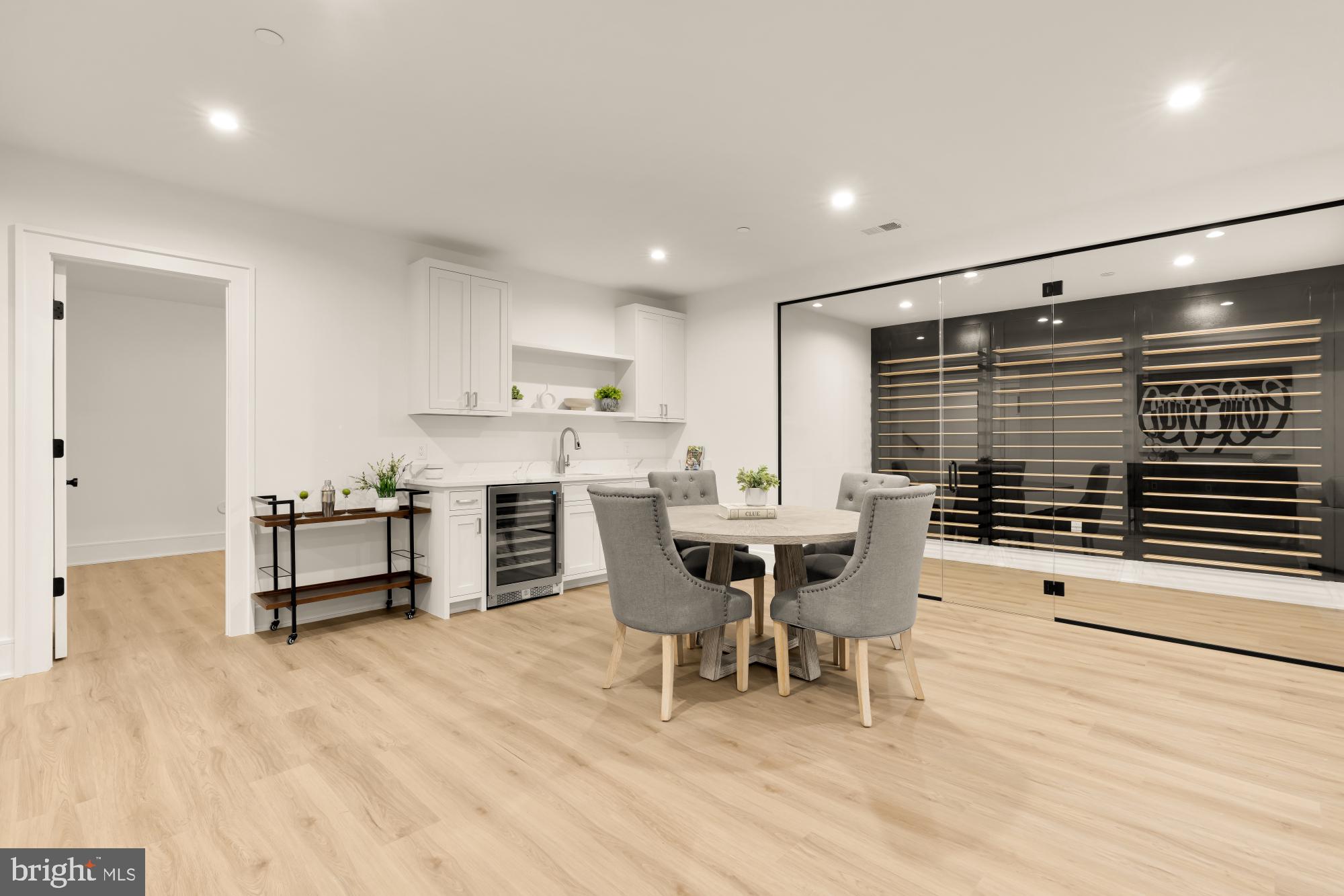 9105 Seven Locks Road Bethesda, MD 20817 - Photo 59 of 84 a dining room with furniture and a kitchen view