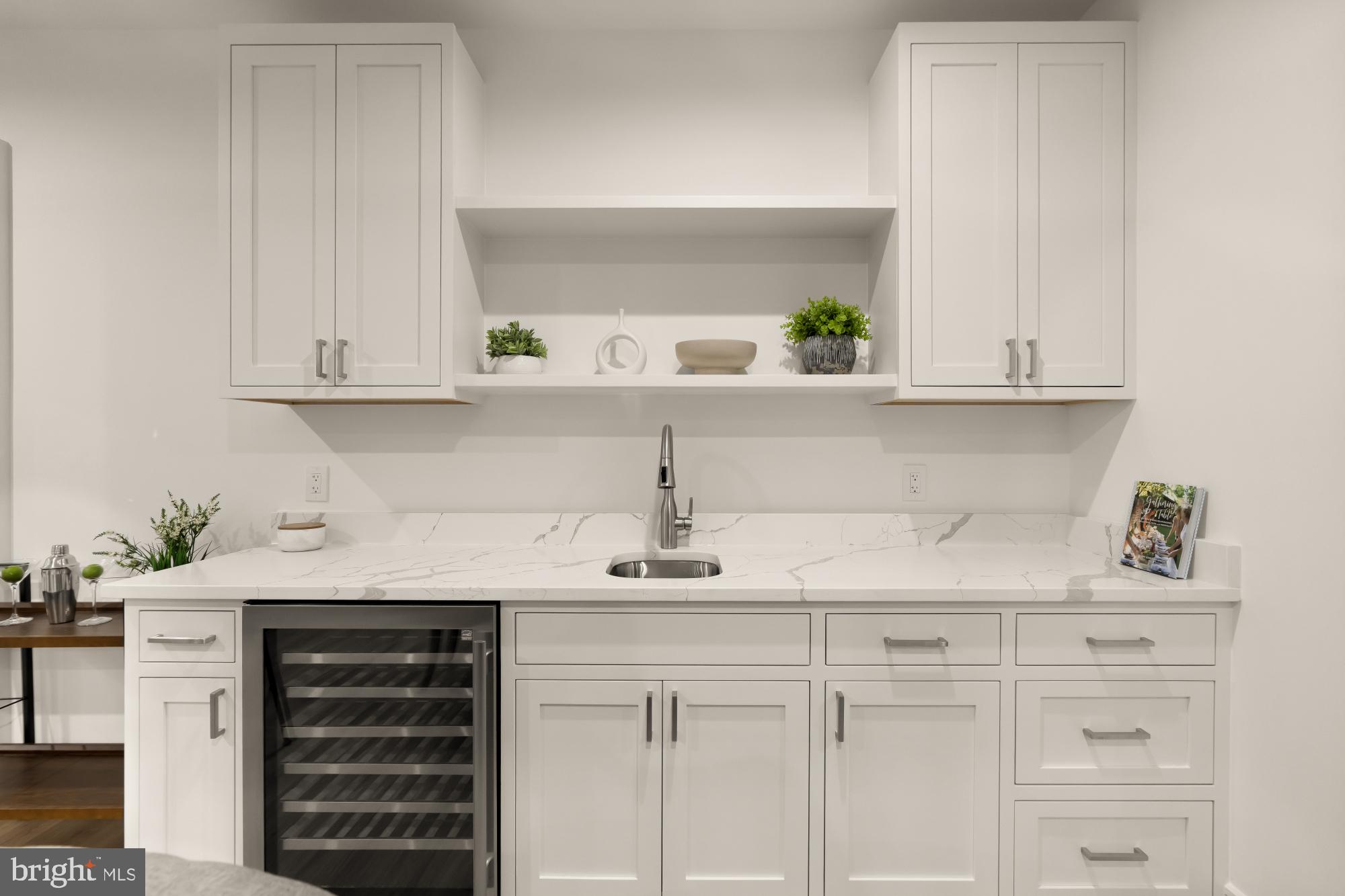 9105 Seven Locks Road Bethesda, MD 20817 - Photo 61 of 84 a kitchen with white cabinets and a stove
