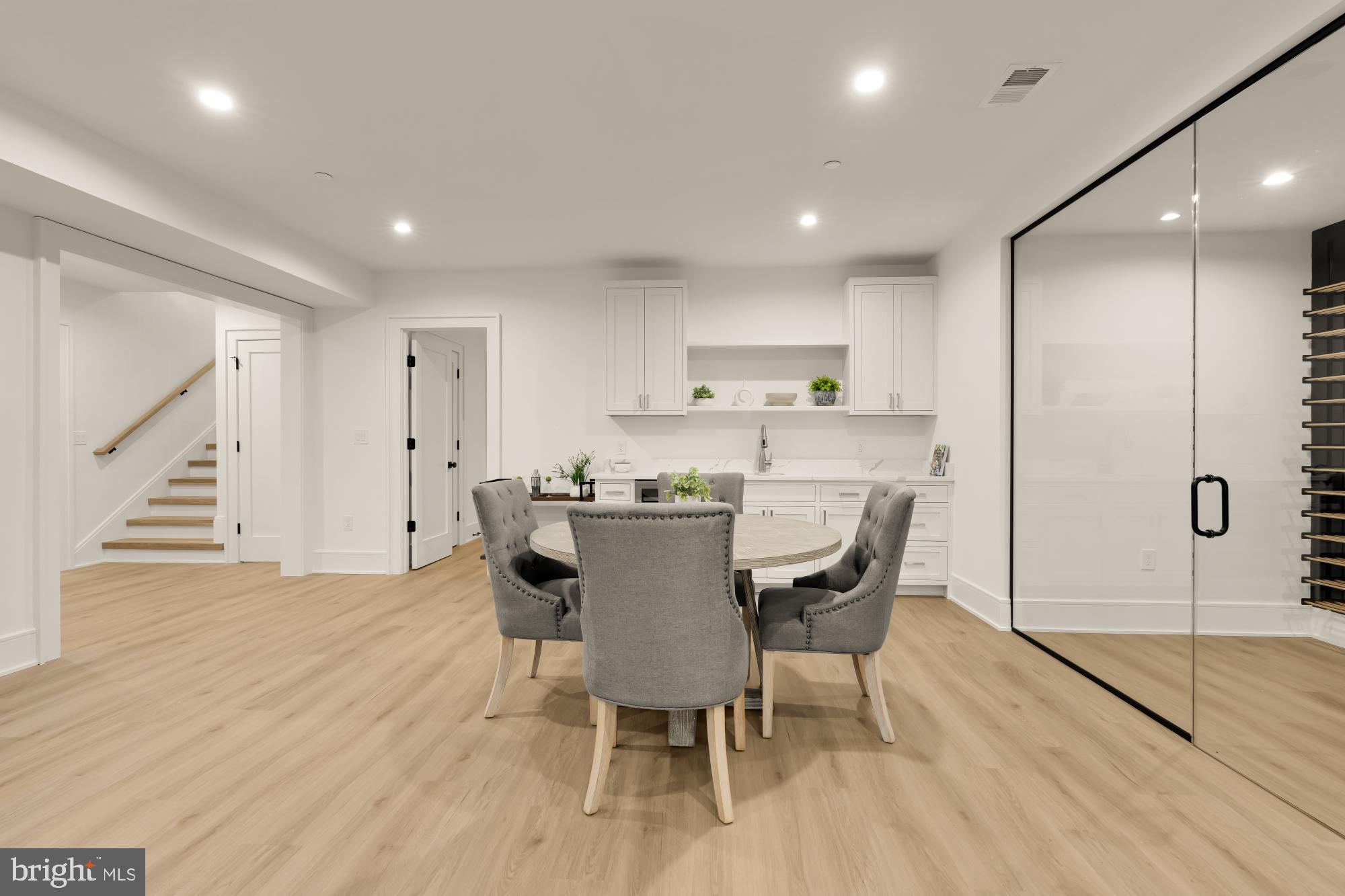 9105 Seven Locks Road Bethesda, MD 20817 - Photo 64 of 84 a view of a dining room with furniture and wooden floor