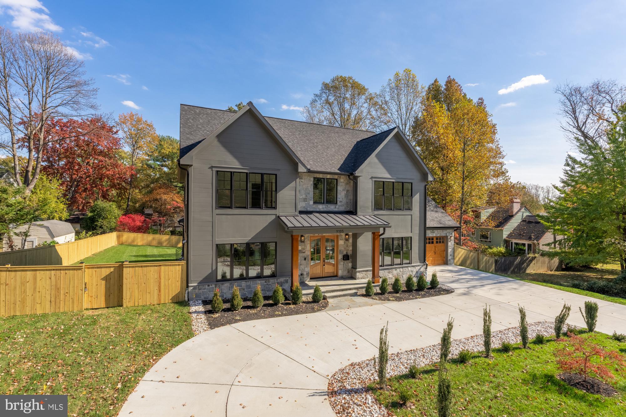 9105 Seven Locks Road Bethesda, MD 20817 - Photo 82 of 84 a front view of a house with a porch and a yard