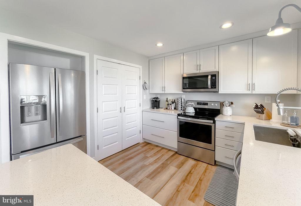 18375 River Road Tall Timbers, MD 20690 - Photo 13 of 61 a kitchen with a refrigerator stove and microwave