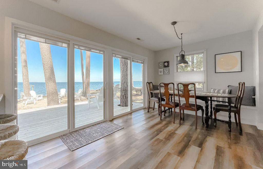 18375 River Road Tall Timbers, MD 20690 - Photo 18 of 61 a view of a dining room with furniture window and wooden floor