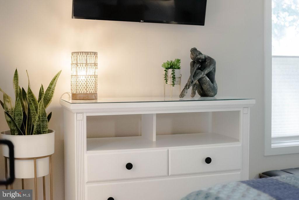 18375 River Road Tall Timbers, MD 20690 - Photo 22 of 61 a bathroom with a tub and a potted plant
