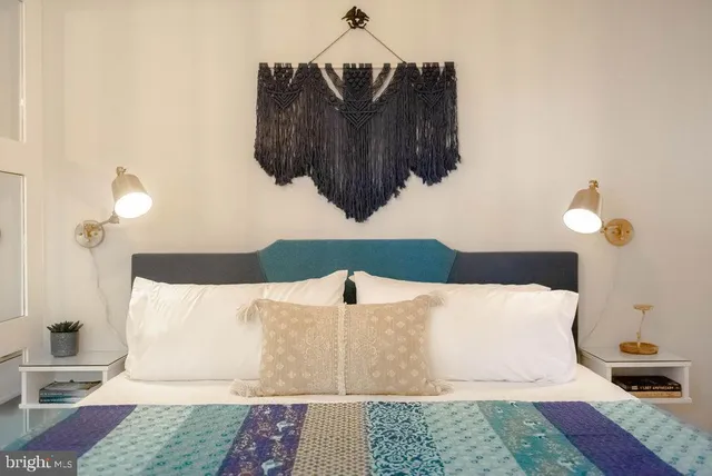 a bedroom with a bed and a rug