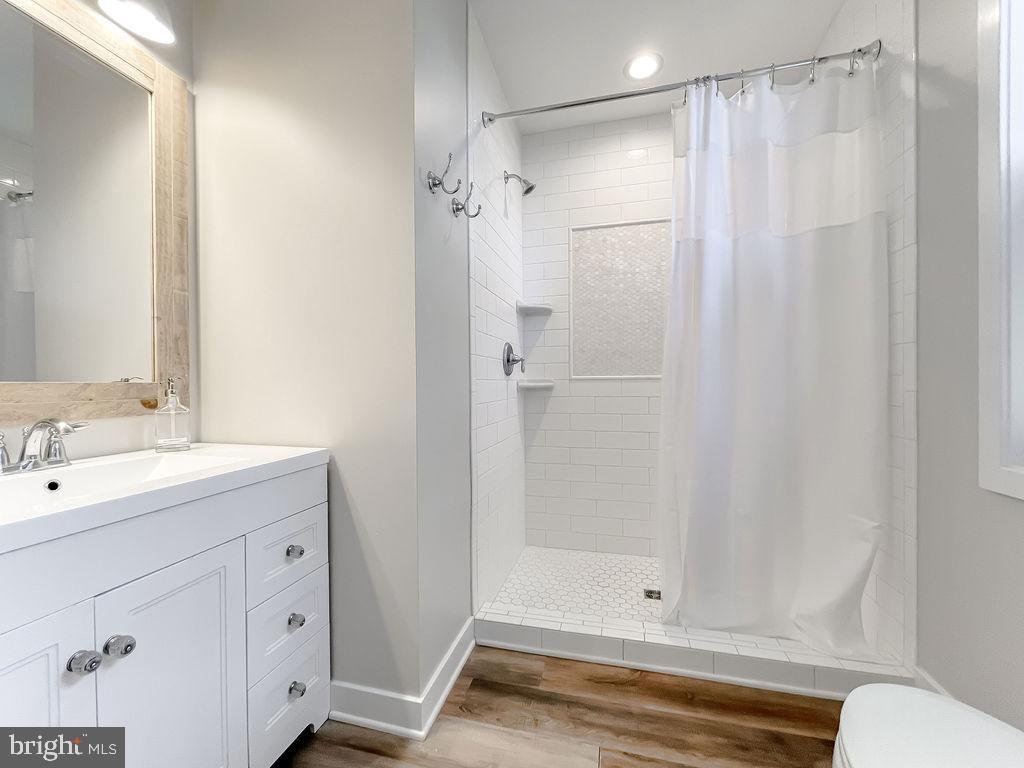 18375 River Road Tall Timbers, MD 20690 - Photo 25 of 61 a bathroom with a shower and a sink