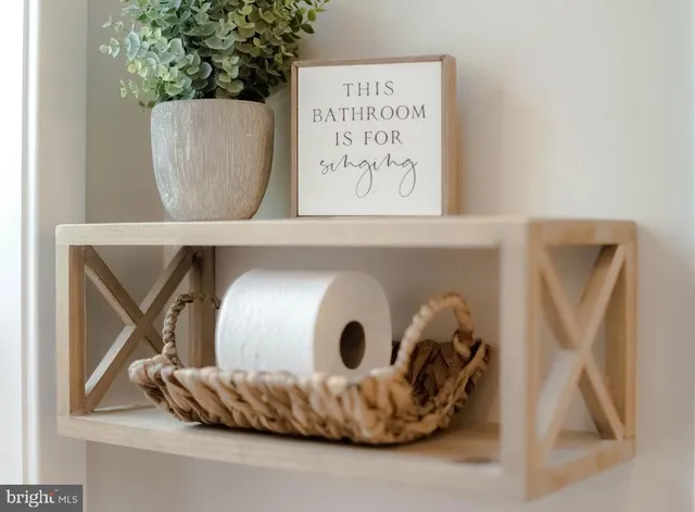 a view of a bedroom with wooden floor