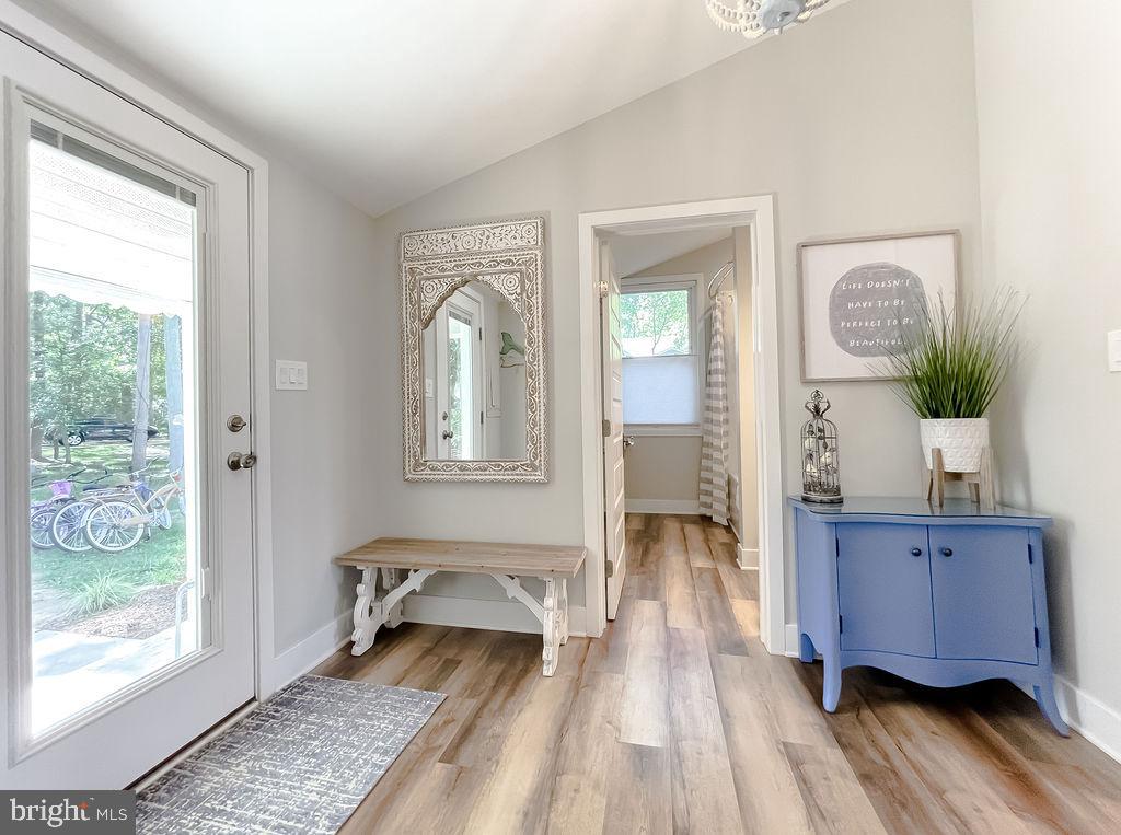 18375 River Road Tall Timbers, MD 20690 - Photo 3 of 61 a living room with furniture and a window