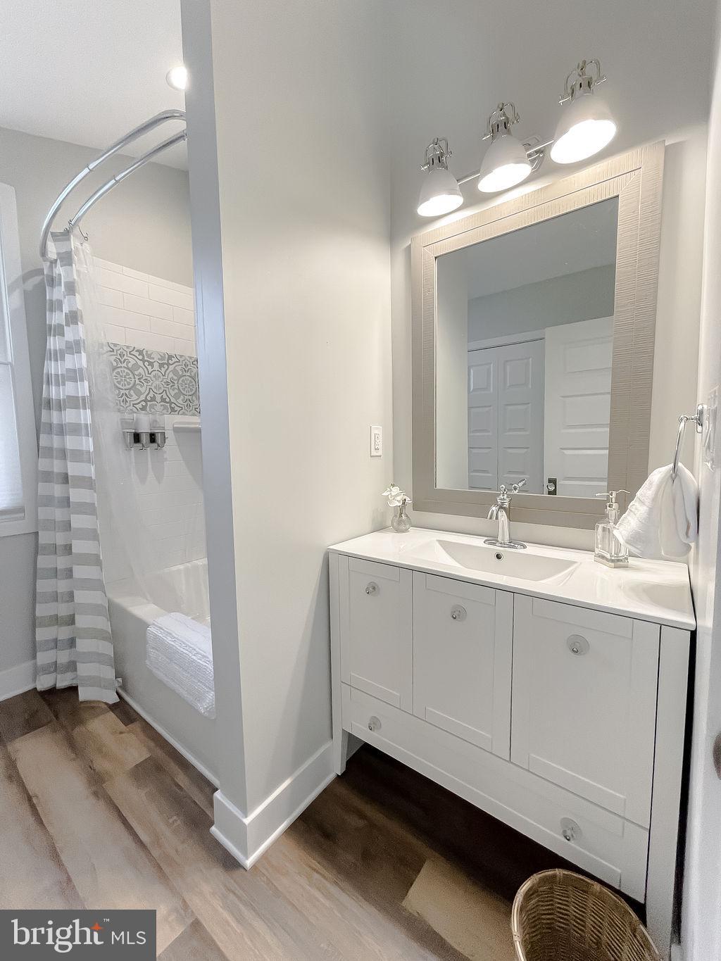 18375 River Road Tall Timbers, MD 20690 - Photo 37 of 61 a bathroom with a double vanity sink and mirror