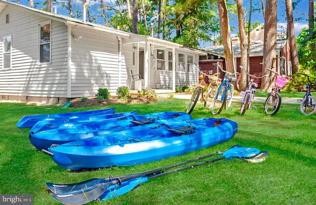 18375 River Road Tall Timbers, MD 20690 - Photo 56 of 61 a view of a backyard with table and chairs and potted plants