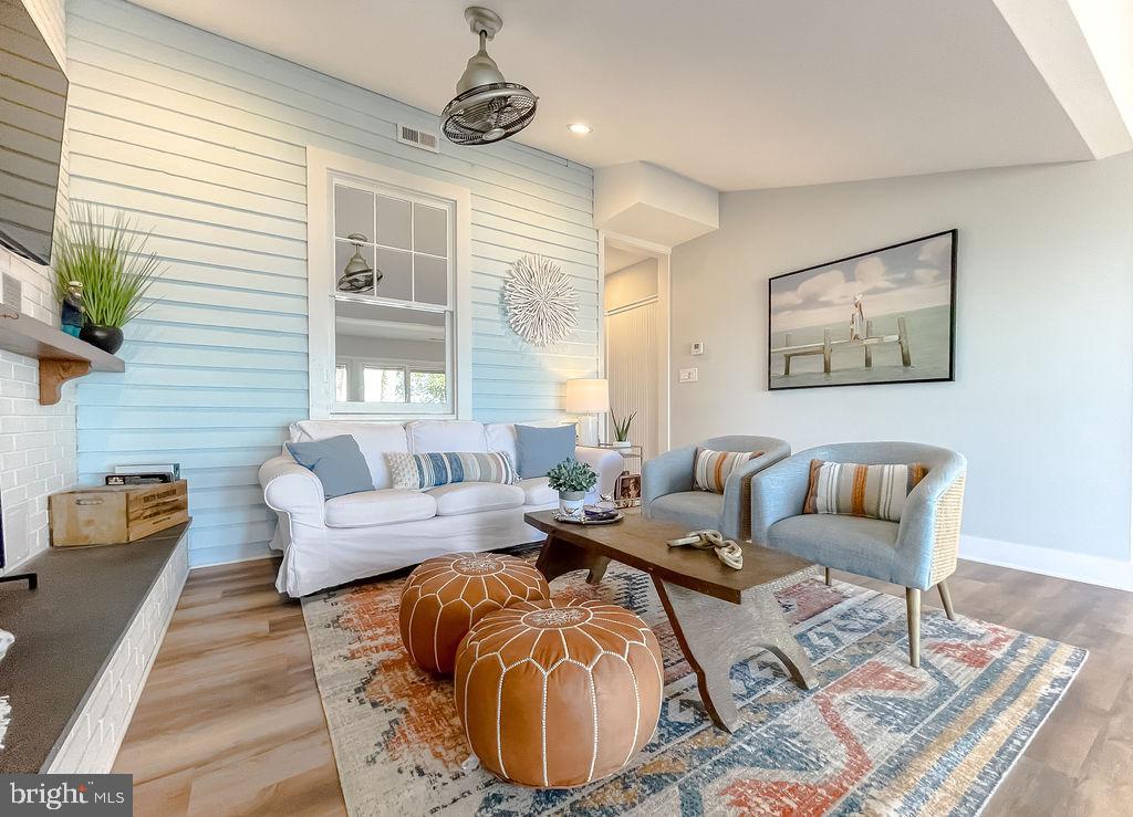 18375 River Road Tall Timbers, MD 20690 - Photo 7 of 61 a living room with furniture and a large window