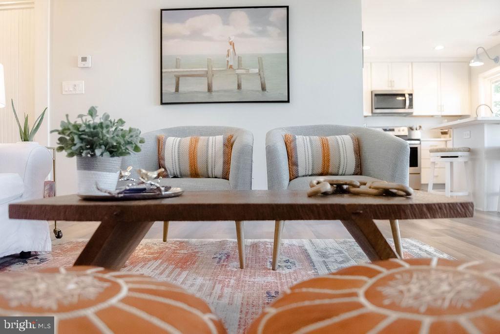 18375 River Road Tall Timbers, MD 20690 - Photo 8 of 61 a view of kitchen island with stainless steel appliances kitchen island granite countertop furniture and living room view