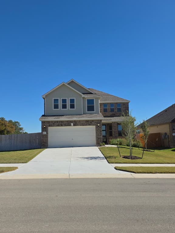 1609 Red Berry Pass Georgetown, TX 78628 - Photo 1 of 29 a front view of a house with a yard