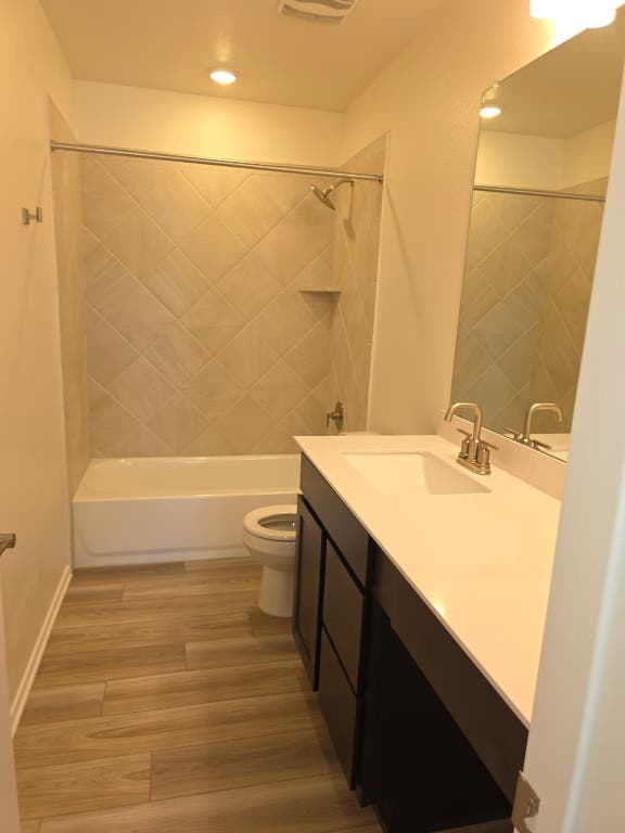 1609 Red Berry Pass Georgetown, TX 78628 - Photo 16 of 29 a bathroom with a sink and a mirror