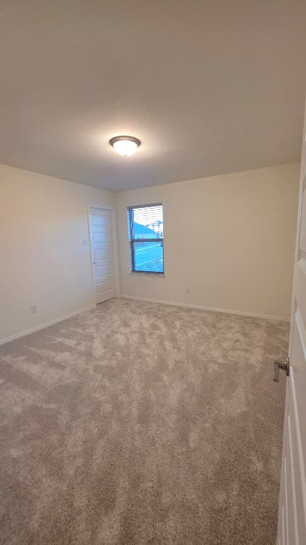 1609 Red Berry Pass Georgetown, TX 78628 - Photo 17 of 29 an empty room with windows